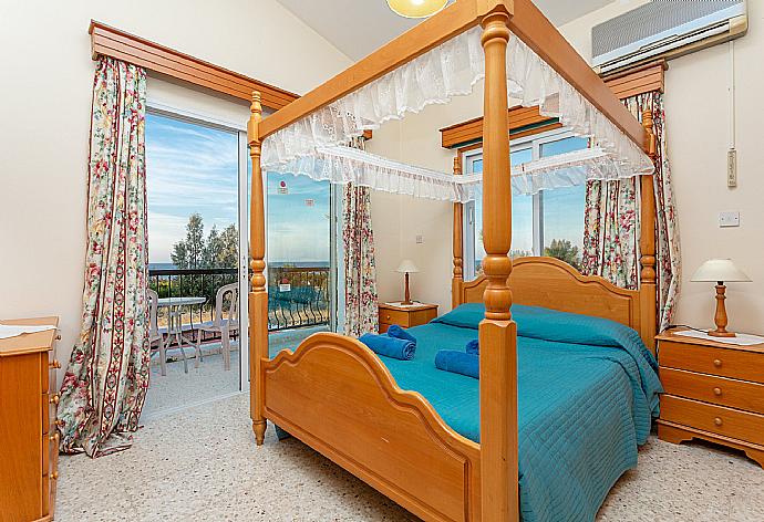 Double bedroom with en suite bathroom, A/C, and balcony with sea views . - Argaka Sun Villa Tria . (Photo Gallery) }}