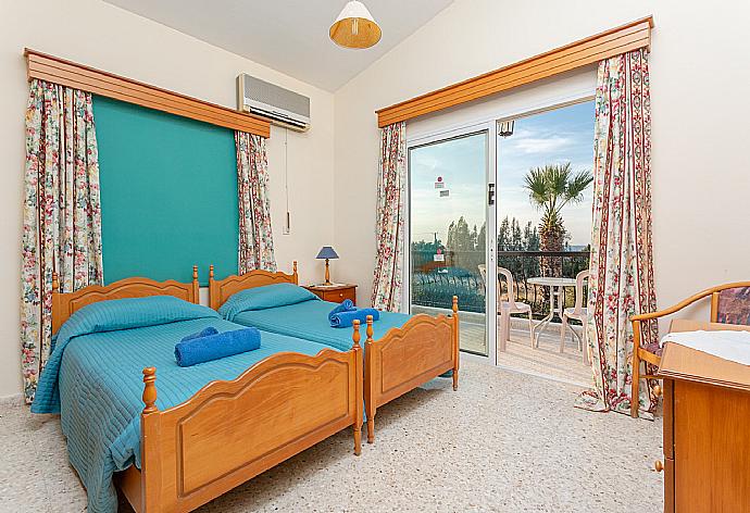 Twin bedroom with en suite bathroom, A/C, and balcony with sea views . - Argaka Sun Villa Tria . (Photo Gallery) }}