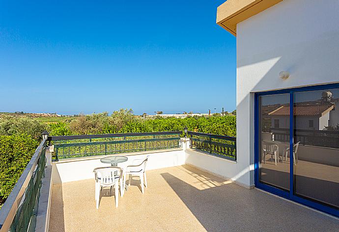 Upper terrace area with countryside views . - Villa Charoula Pente . (Photo Gallery) }}