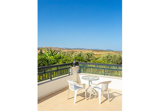 Upper terrace with countryside views . - Villa Charoula Pente . (Photo Gallery) }}