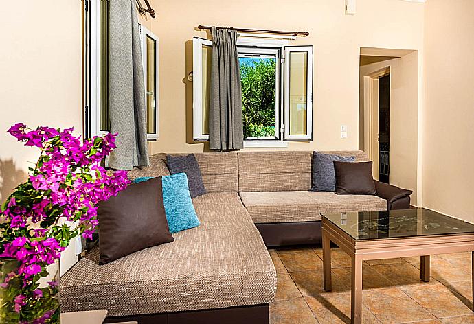 Open-plan living room with sofas, WiFi Internet, Satellite TV, dining area and ornamental fire place. . - Villa Antonio . (Галерея фотографий) }}
