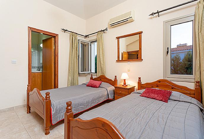 Twin bedroom with en suite bathroom, A/C, and balcony with sea views . - Villa Jan Lui . (Photo Gallery) }}