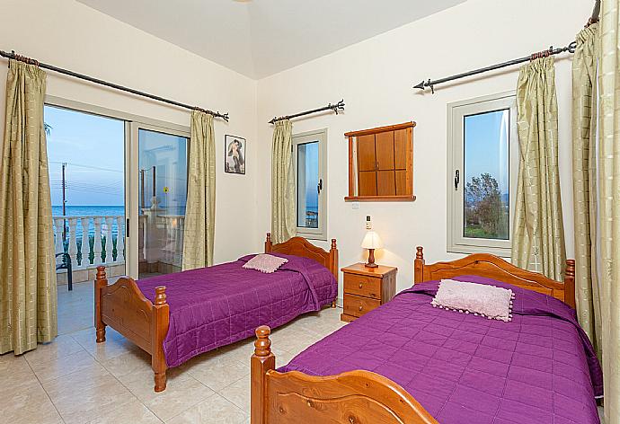 Twin bedroom with en suite bathroom, A/C, and balcony with sea views . - Villa Jan Lui . (Photo Gallery) }}