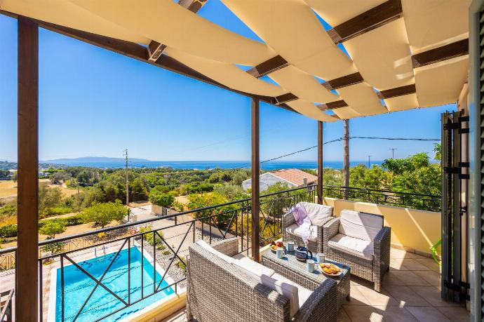 Upper terrace area with sea views . - Rose Villa . (Photo Gallery) }}