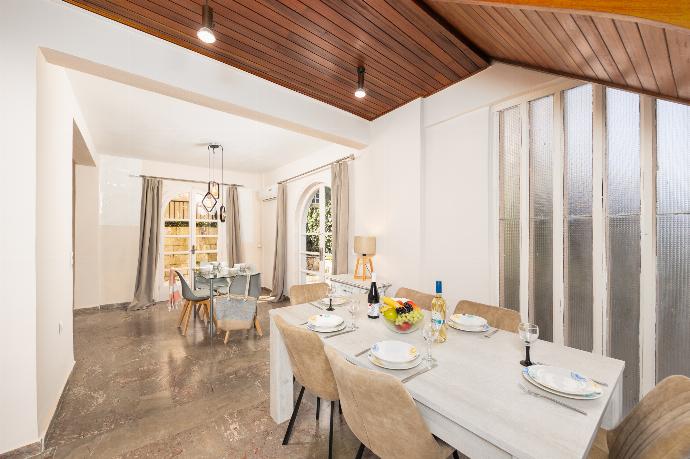 Dining area with A/C . - Villa Litsa . (Photo Gallery) }}