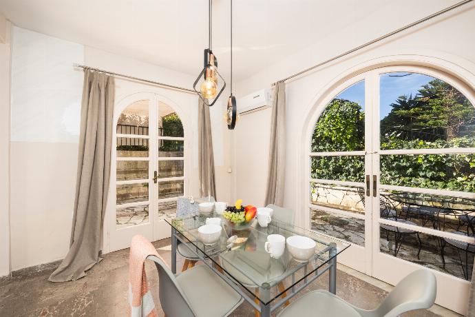 Dining area with A/C . - Villa Litsa . (Photo Gallery) }}