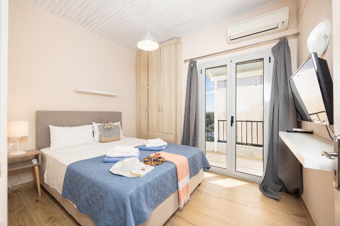 Double bedroom with A/C . - Villa Litsa . (Photo Gallery) }}