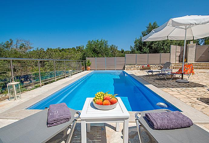 Private pool with outdoor area . - Villa Constadina . (Photo Gallery) }}