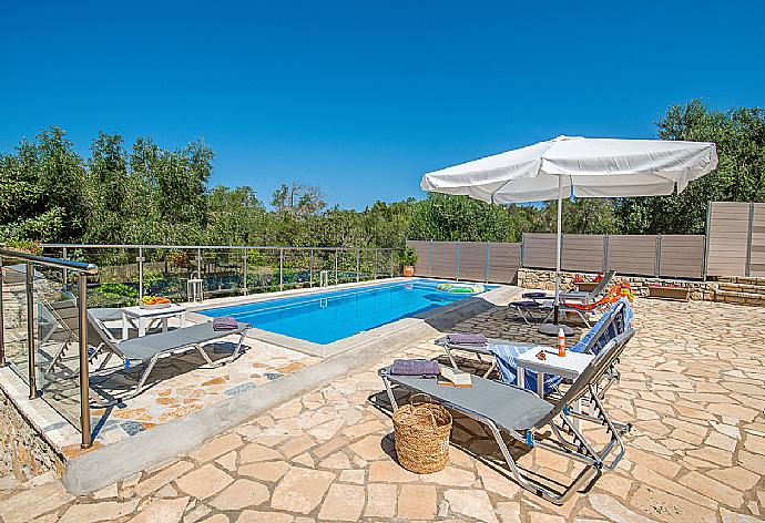 Private pool with outdoor area . - Villa Constadina . (Photo Gallery) }}