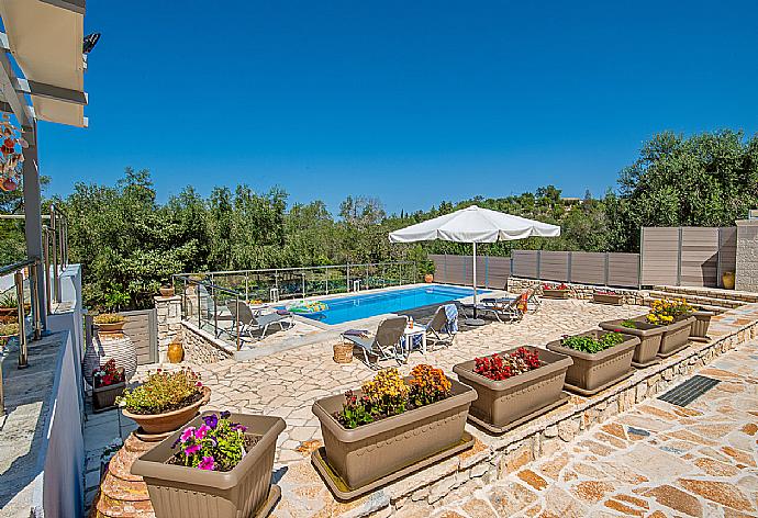 Private pool with outdoor area . - Villa Constadina . (Photo Gallery) }}