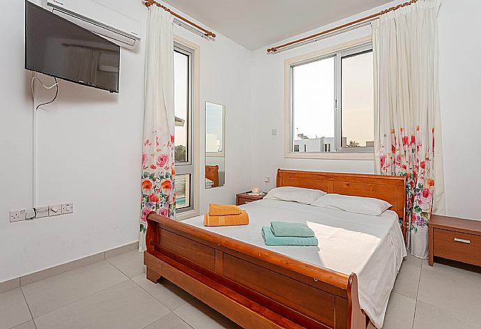 Double bedroom with A/C, satellite TV, and balcony access . - Colonian Villa . (Photo Gallery) }}