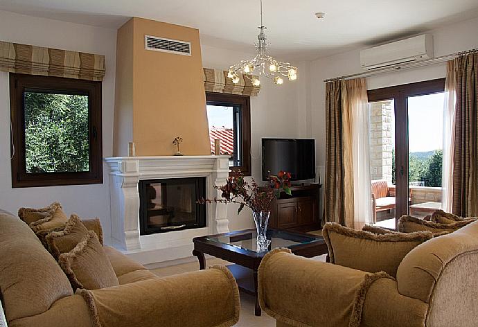 Open-plan living room with sofa with fire place . - Villa Maria . (Photo Gallery) }}