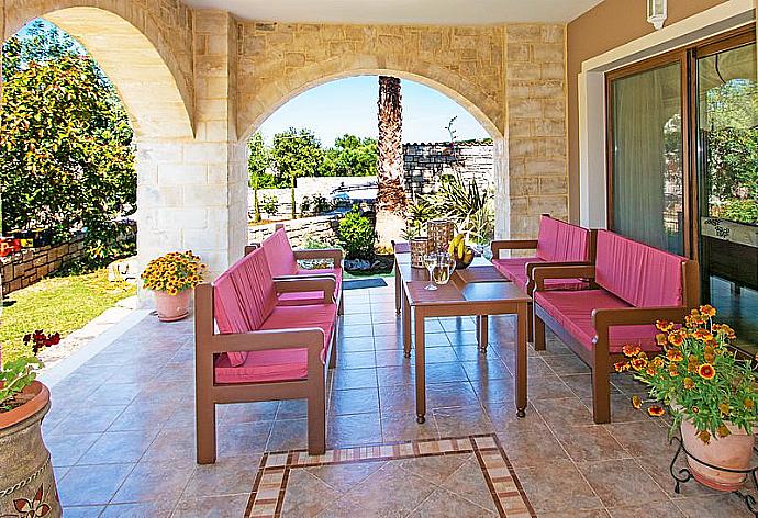 Terrace area with outdoor seating . - Iris Villa . (Photo Gallery) }}