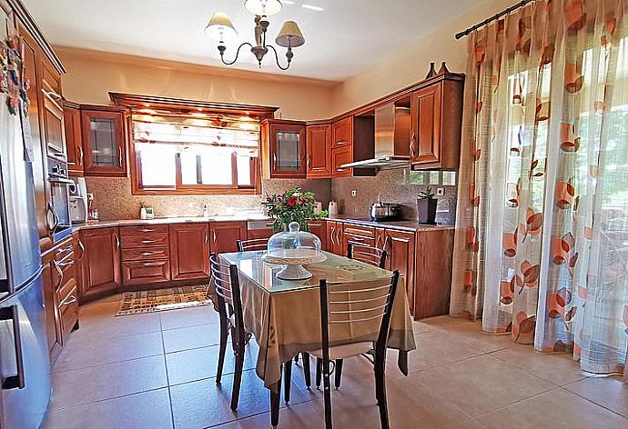 Dining area and  kitchen . - Iris Villa . (Photo Gallery) }}