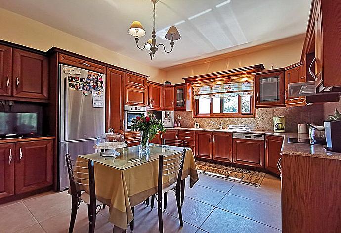 Dining area and  kitchen . - Iris Villa . (Photo Gallery) }}