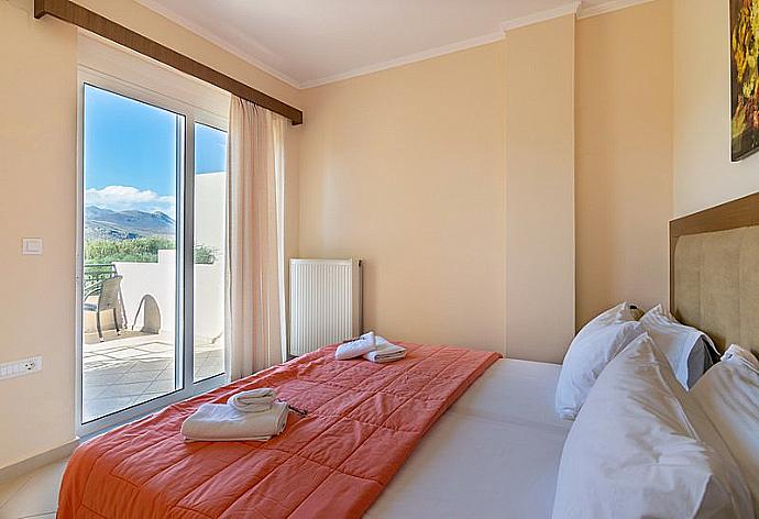 Double bedroom with balcony access  . - Villa Selini 4 . (Photo Gallery) }}