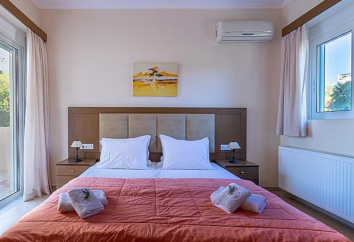 Double bedroom with balcony access . - Villa Selini 3 . (Галерея фотографий) }}