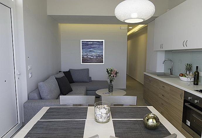 Open -concept living room with kitchen and dining area . - Sonja Apartment 2 . (Photo Gallery) }}