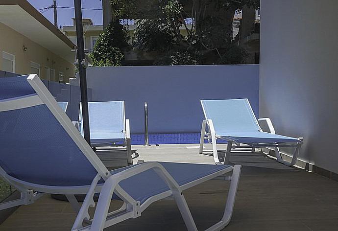 Pool area with sunbeds . - Sonja Apartment 2 . (Photo Gallery) }}