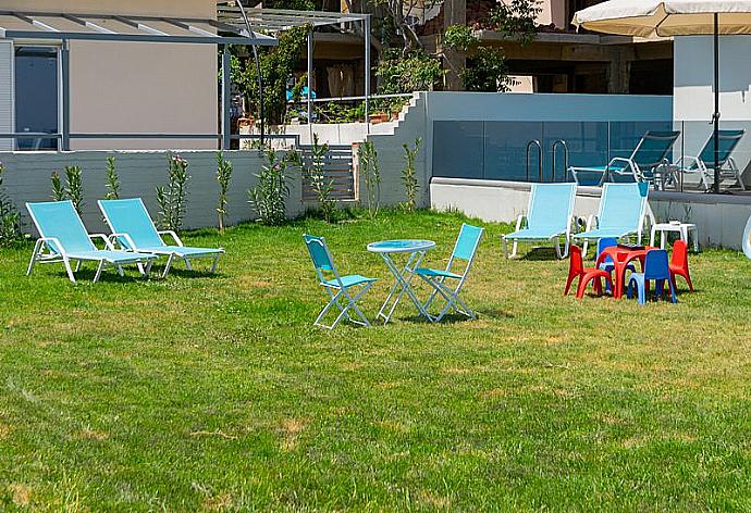 Outdoor area with sunbeds and playground . - Sonja Superior Apartment 3 . (Photo Gallery) }}