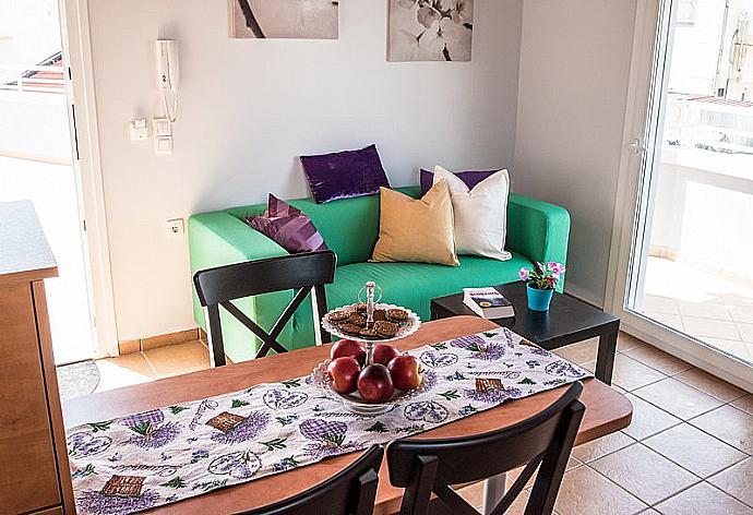 Open-plan living room with sofa, dining area, kitchen, A/C, WiFi internet, and satellite TV  . - Mare Civitas Penthouse . (Fotogalerie) }}