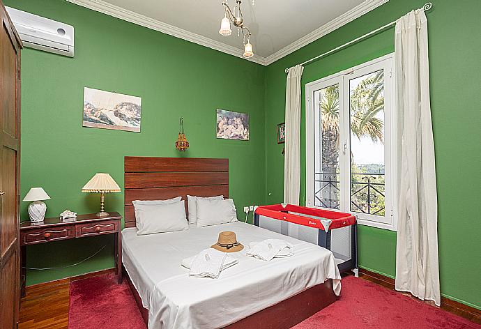 Double bedroom with A/C and TV . - Villa Golden Tiara . (Photo Gallery) }}
