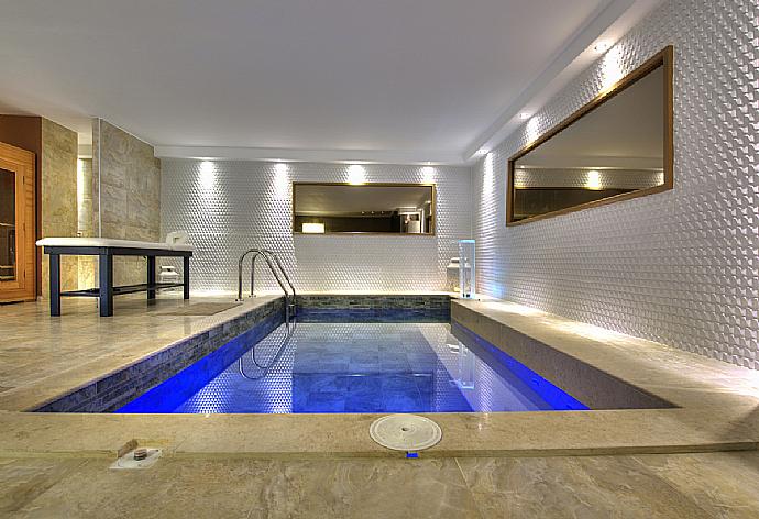 Spa area with massage table and pool . - Spa Villa . (Photo Gallery) }}