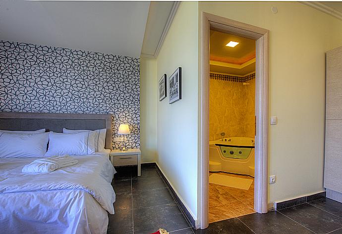 Double bedroom with terrace access . - Grand Villa Athos . (Photo Gallery) }}