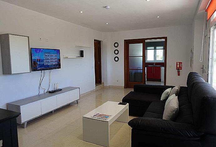 Living room with WiFi, TV, DVD player and terrace access . - Villa Rasen . (Photo Gallery) }}