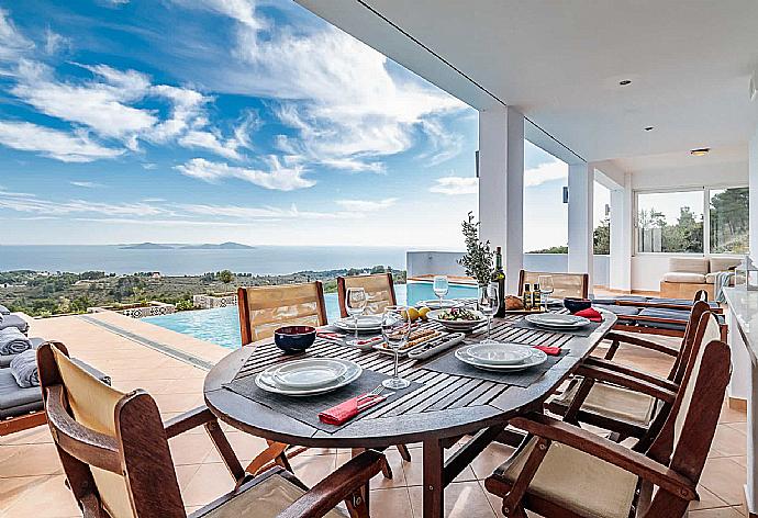 Outdoor sheltered dining  . - Villa Porfyra . (Photo Gallery) }}