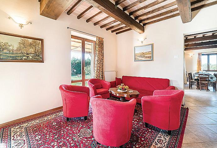 Open-plan living room with sofas, DVD player and dining area. . - Villa San Lorenzo . (Galería de imágenes) }}