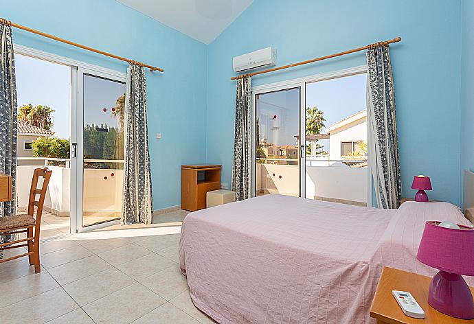 Double bedroom with en suite bathroom, A/C, and balcony access . - Villa Coral Aura . (Photo Gallery) }}