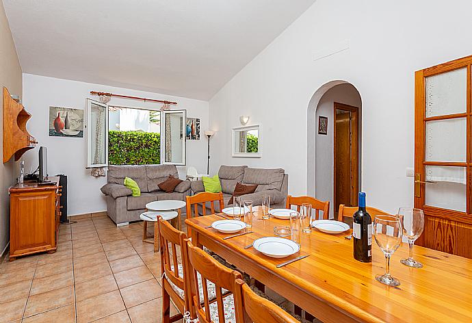 Living room with sofas, dining area, WiFi internet, satellite TV, and terrace access . - Villa Clariana . (Fotogalerie) }}