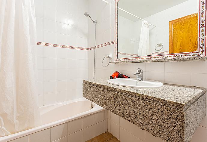 En suite bathroom with bath and shower . - Villa Clariana . (Photo Gallery) }}