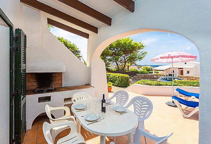 Sheltered terrace area with BBQ . - Villa Binibety . (Photo Gallery) }}