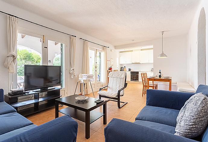 Open-plan living room with sofas, dining area, kitchen, WiFi internet, satellite TV, and terrace access . - Villa Binibety . (Fotogalerie) }}