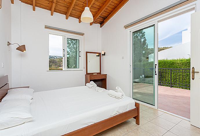 Double bedroom with A/C and terrace access . - Villa Chrysanthemum . (Galleria fotografica) }}