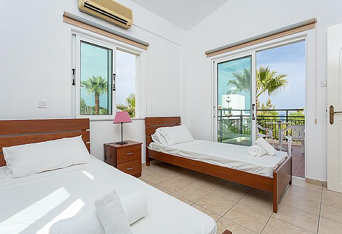 Twin bedroom with A/C and balcony access . - Villa Chrysanthemum . (Photo Gallery) }}