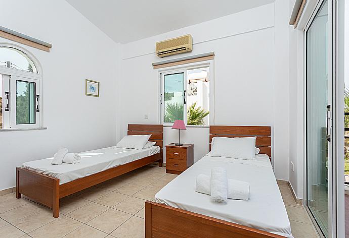 Twin bedroom with A/C and balcony access . - Villa Chrysanthemum . (Photo Gallery) }}