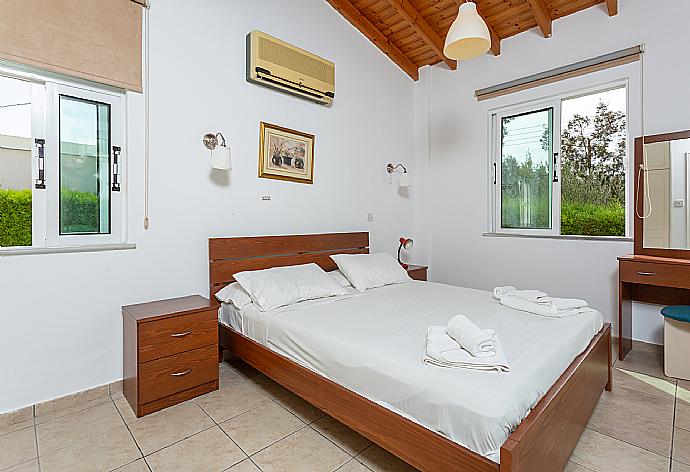 Double bedroom with A/C and terrace access . - Villa Cleopatra . (Photo Gallery) }}