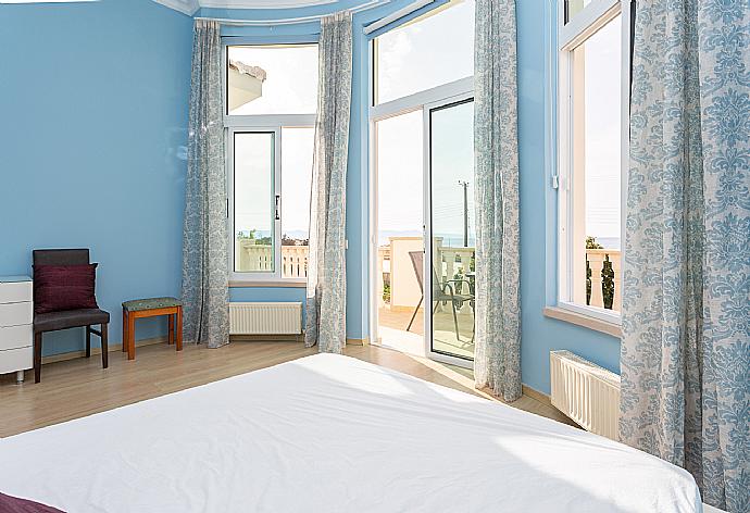 Double bedroom with en suite bathroom, A/C, and balcony access with sea views . - Villa Komissa . (Photo Gallery) }}