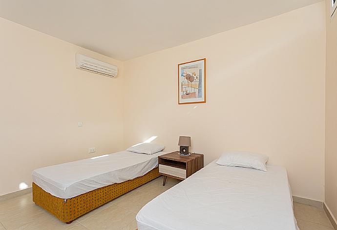 Twin bedroom with en suit bathroom, A/C and sofa . - Villa Komissa . (Photo Gallery) }}