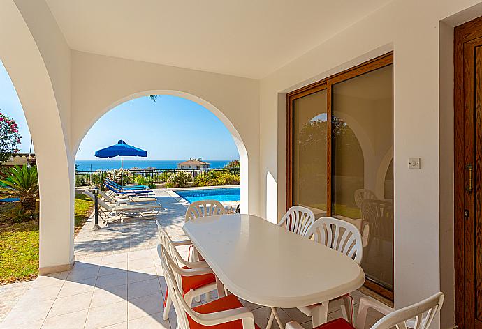 Sheltered terrace area with sea views . - Villa Ellada 2 . (Photo Gallery) }}