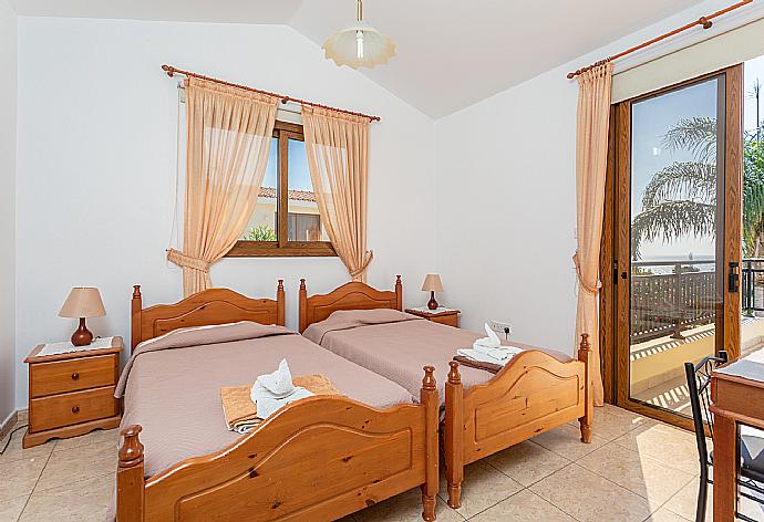 Twin bedroom with en suite bathroom, A/C, and upper terrace access with sea views . - Villa Ellada 2 . (Галерея фотографий) }}