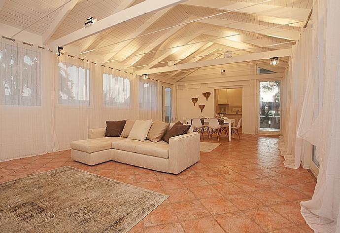 Living room with sofa, dining area, A/C, WiFi internet, and satellite TV . - Villa Lory . (Photo Gallery) }}