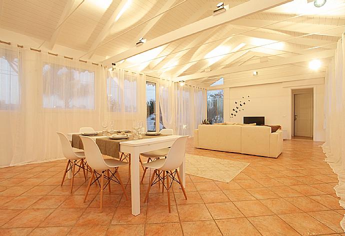 Living room with sofa, dining area, A/C, WiFi internet, and satellite TV . - Villa Lory . (Photo Gallery) }}