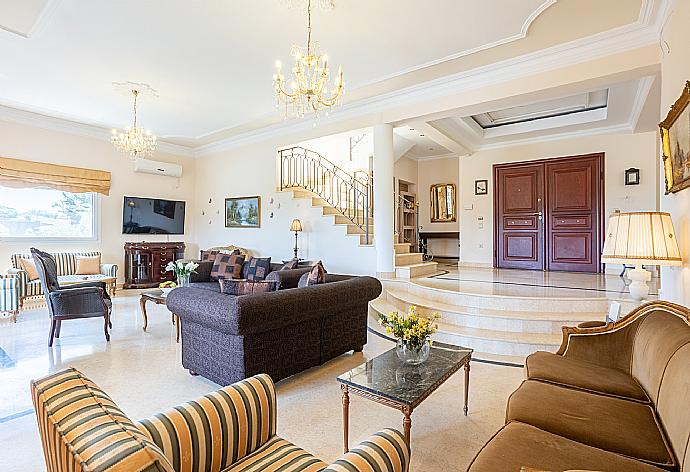 Living room with sofas, dining area, ornamental fireplace, A/C, WiFi internet, and satellite TV, and terrace access . - Villa Denise . (Photo Gallery) }}