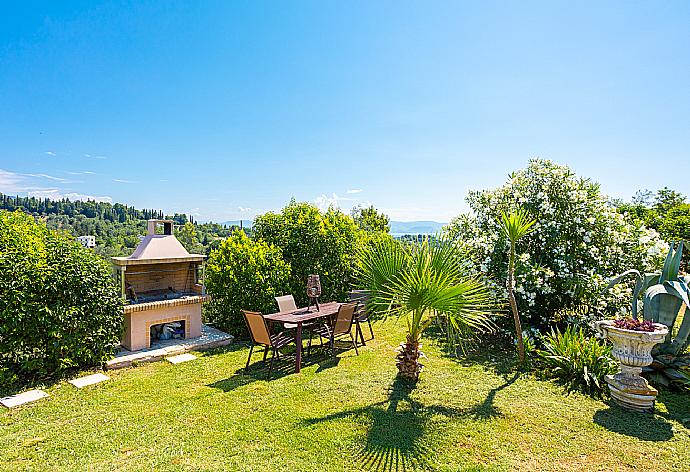 Garden area with BBQ . - Villa Denise . (Photo Gallery) }}