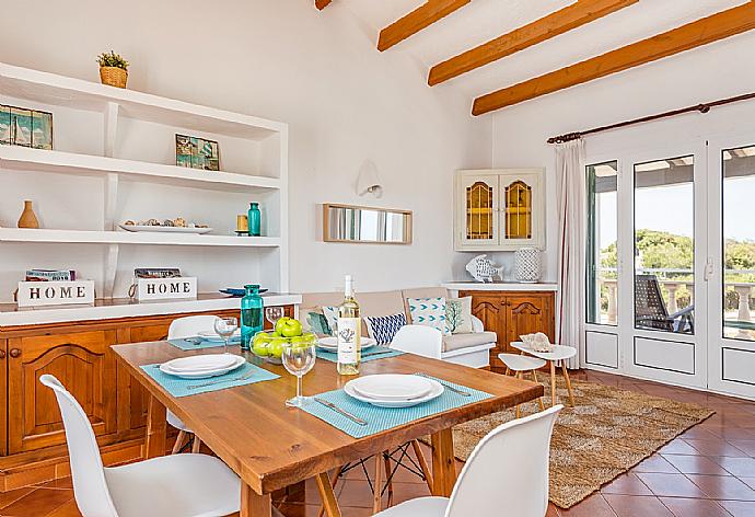 Living room with sofas, dining area, ornamental fireplace, WiFi internet, satellite TV, DVD player, and terrace access . - Villa Miguels . (Galleria fotografica) }}