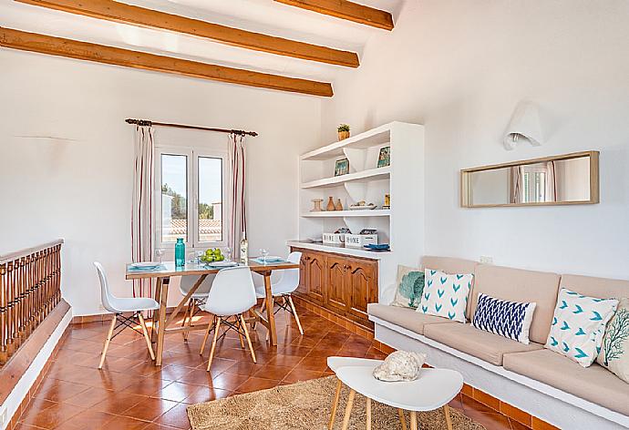 Living room with sofas, dining area, ornamental fireplace, WiFi internet, satellite TV, DVD player, and terrace access . - Villa Miguels . (Galleria fotografica) }}